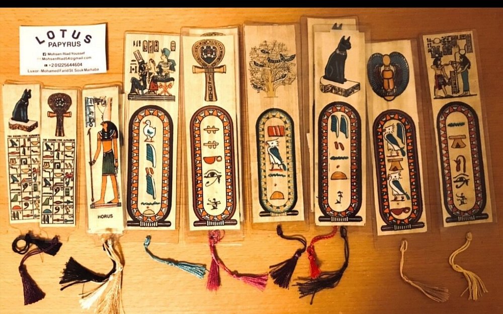 Luxor antiques and papyrus items flat lay